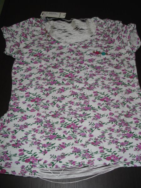 Blusa estampada com franja nas costas